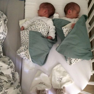 newborn twins in same crib